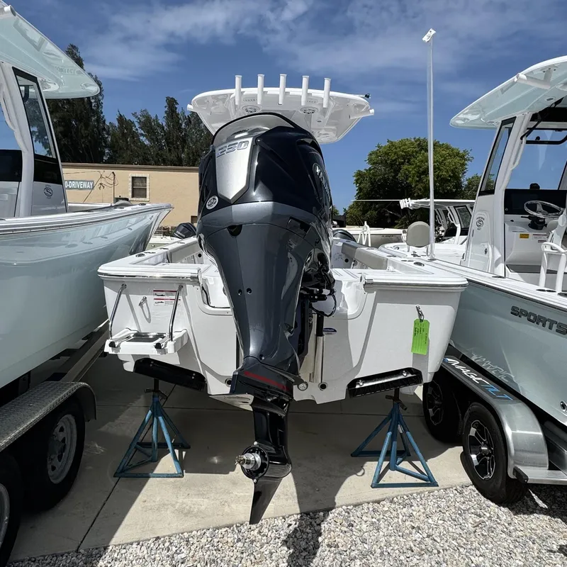 Slide: The Image of 2025 Sportsman Masters 247 Bay Boat with powerful outboard motor, displayed outdoors. - 3