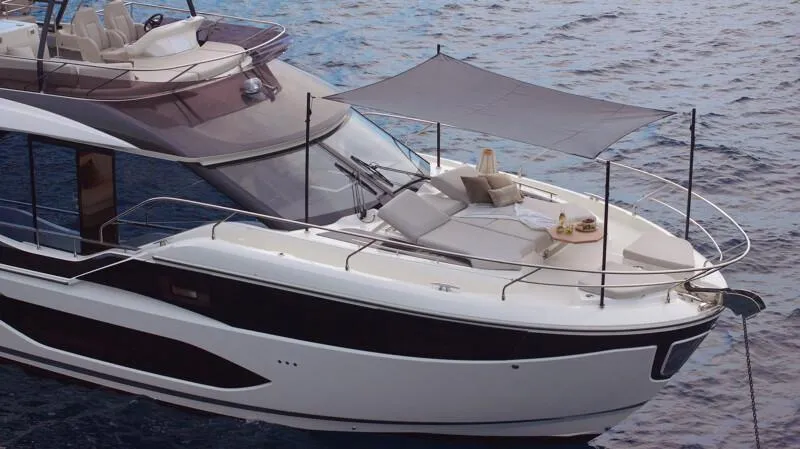 Slide: The Image of Luxury Prestige F5.7 yacht, 2026 model, with sunshade and elegant deck on calm water. - 12