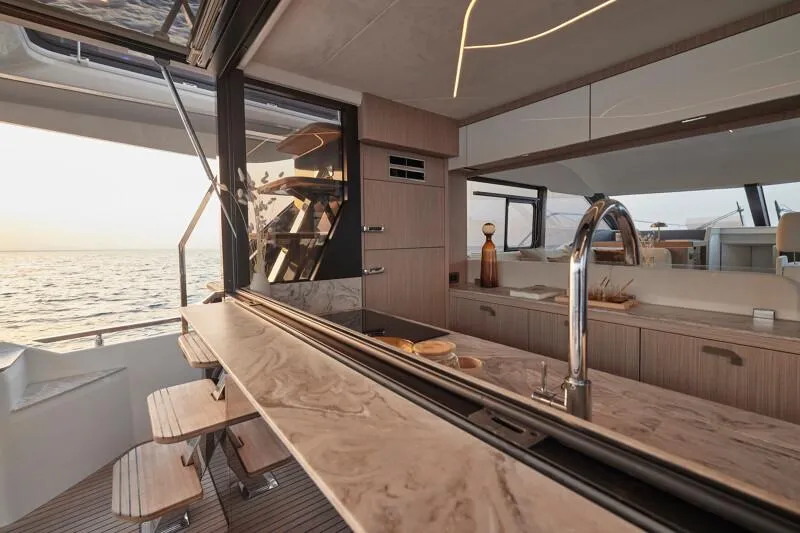 Slide: The Image of Luxurious Prestige F5.7 yacht interior, featuring modern kitchen and ocean view, 2026 model. - 20