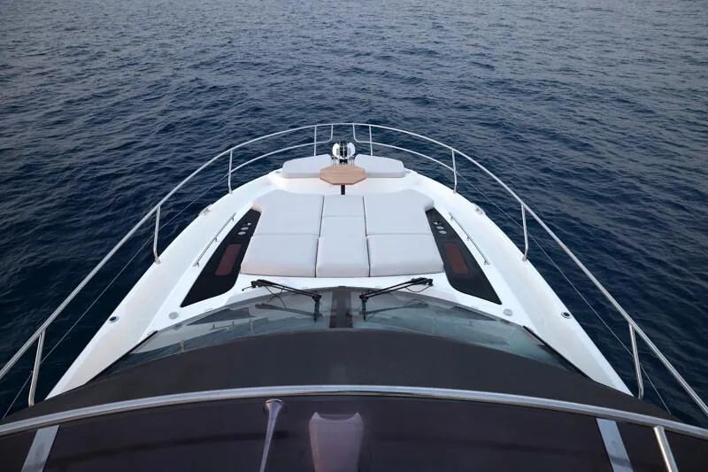 Slide: The Image of Prestige F5.7 yacht bow view, 2026 model, cruising on calm ocean waters. - 27
