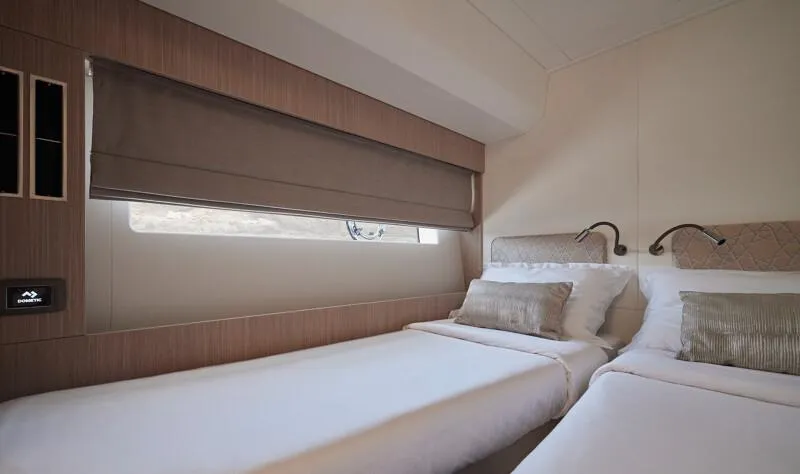 Slide: The Image of Luxurious twin bedroom in 2026 Prestige F5.7 yacht, featuring elegant decor and comfortable bedding. - 42