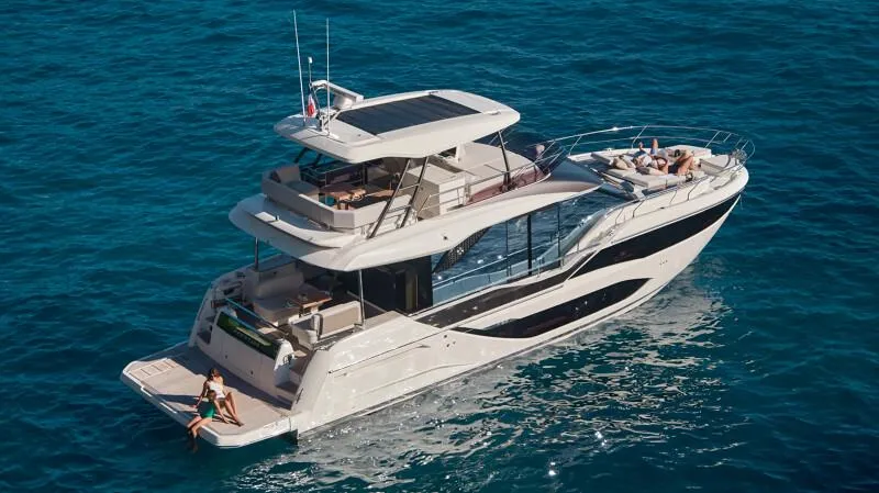 Slide: The Image of Luxurious 2026 Prestige F5.7 yacht cruising on clear blue waters. - 8