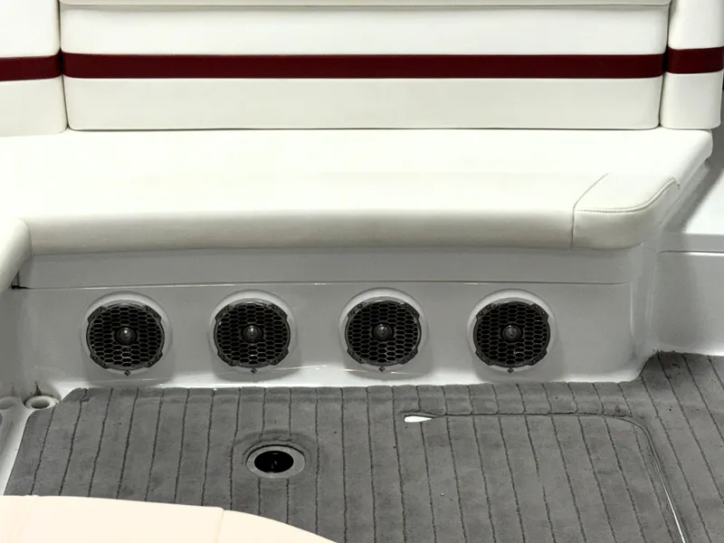 Slide: The Image of 2008 Formula 330 Sun Sport boat interior with speakers and cushioned seating. - 10