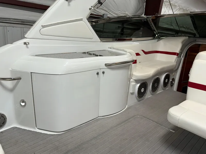Slide: The Image of 2008 Formula 330 Sun Sport boat interior with white seating and red accents. - 12