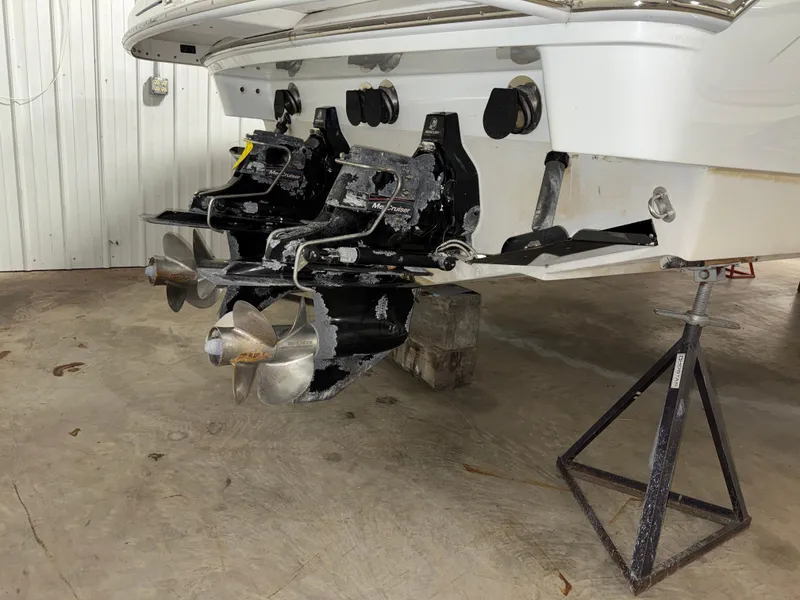 Slide: The Image of 2008 Formula 330 Sun Sport boat with dual propellers in a garage setting. - 19