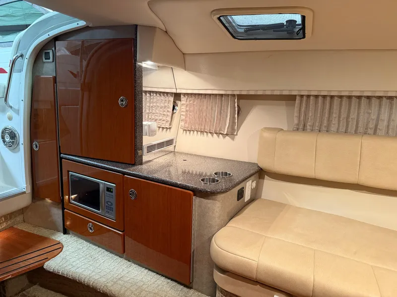 Slide: The Image of 2008 Formula 330 Sun Sport cabin interior with kitchenette and seating area. - 21