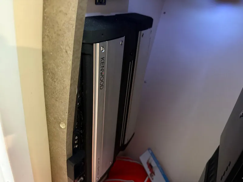 Slide: The Image of Kenwood audio equipment inside a 2008 Formula 330 Sun Sport boat compartment. - 26