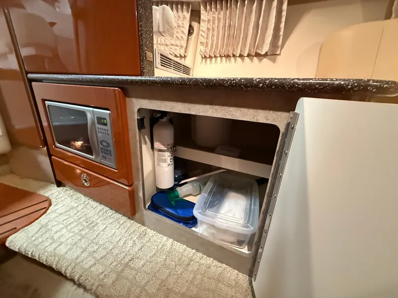 Slide: The Image of 2008 Formula 330 Sun Sport interior with microwave and storage compartment. - 28