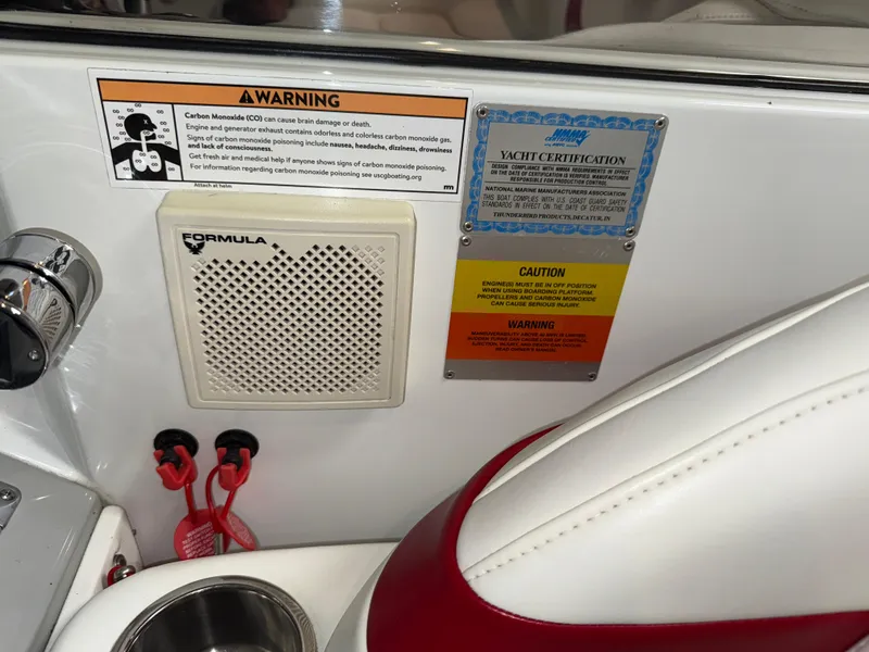 Slide: The Image of 2008 Formula 330 Sun Sport interior with warning labels and yacht certification. - 34