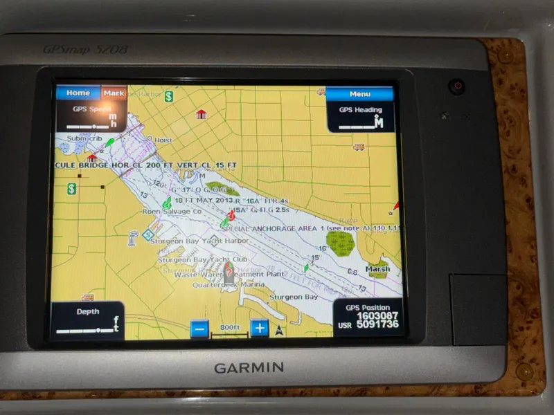 Slide: The Image of Garmin GPS display on 2008 Formula 330 Sun Sport, showing navigation map and coordinates. - 37