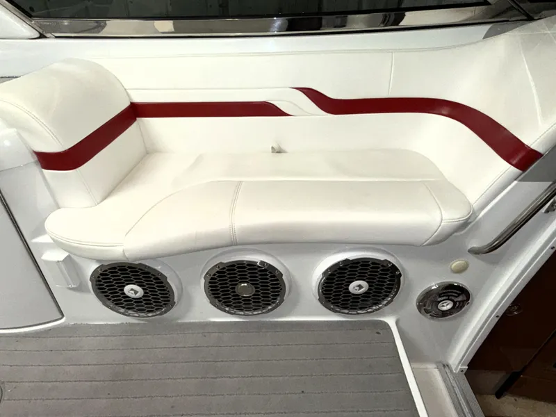 Slide: The Image of 2008 Formula 330 Sun Sport boat interior with white and red seating and speaker system. - 5