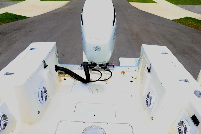 Slide: The Image of 1990 Mako 230 Walk Around boat with outboard motor, rear deck view. - 8