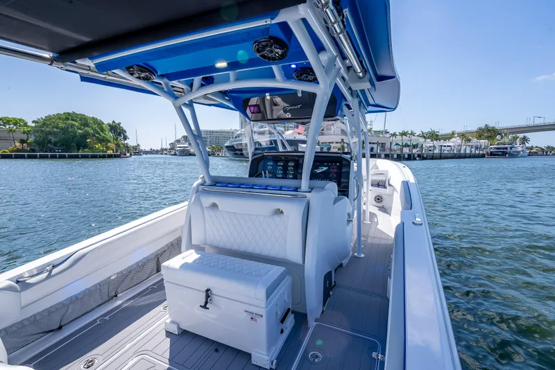 Slide: The Image of 2025 Nor-Tech 340 Sport boat interior with modern design, docked on a sunny day. - 38