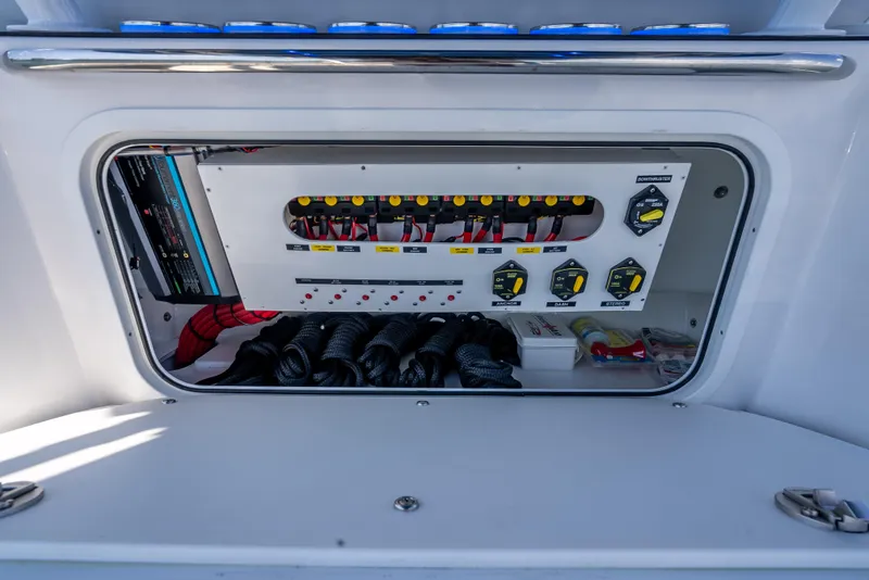 Slide: The Image of Electrical panel of 2025 Nor-Tech 340 Sport boat, featuring switches and wiring. - 42