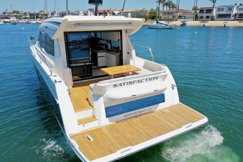 Slide: The Image of 2020 Prestige 460S yacht named "Satisfaction" cruising in Newport Beach waters. - 10