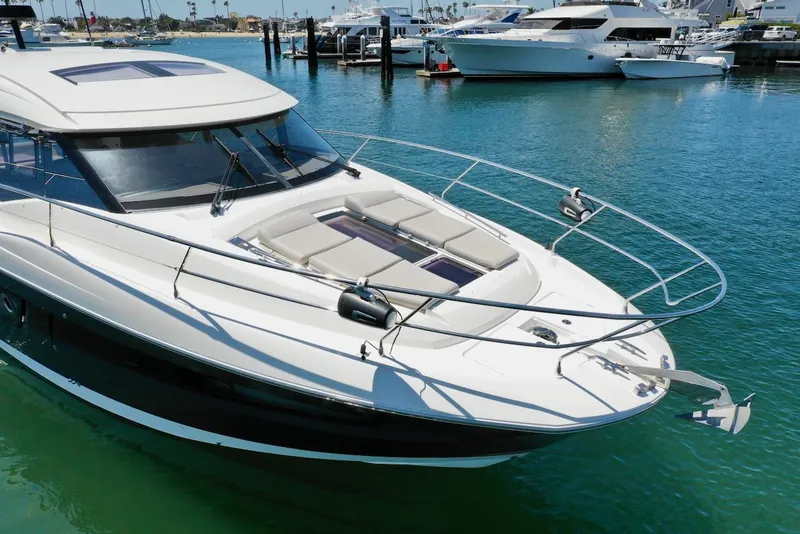 Slide: The Image of Luxurious 2020 Prestige 460S yacht docked in a serene marina setting. - 13