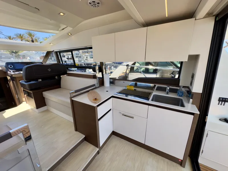 Slide: The Image of Luxurious interior of 2020 Prestige 460S yacht with modern kitchen and seating area. - 19