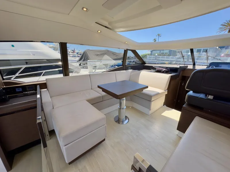 Slide: The Image of Luxurious interior of 2020 Prestige 460S yacht with modern seating and table. - 21