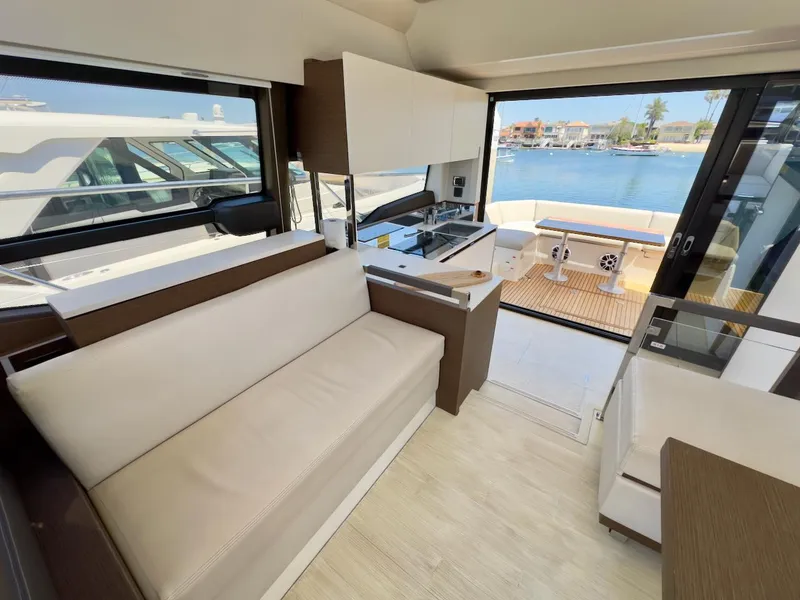 Slide: The Image of Luxurious interior of 2020 Prestige 460S yacht with modern seating and scenic water view. - 22