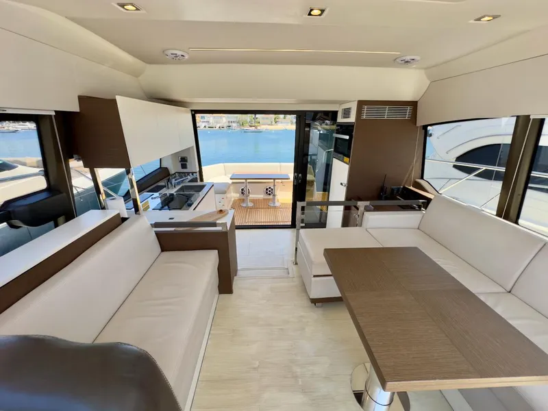 Slide: The Image of Luxurious interior of 2020 Prestige 460S yacht with modern seating and dining area. - 23