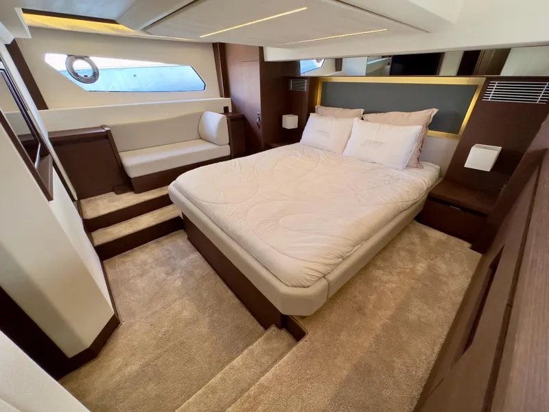 Slide: The Image of Luxurious bedroom interior of 2020 Prestige 460S yacht with modern design and cozy bedding. - 28