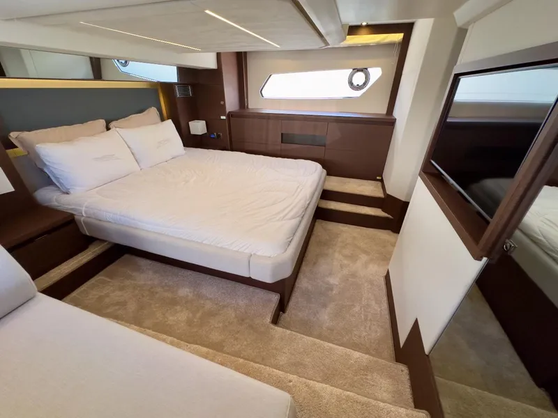 Slide: The Image of Luxurious bedroom interior of 2020 Prestige 460S yacht with modern design and cozy ambiance. - 29