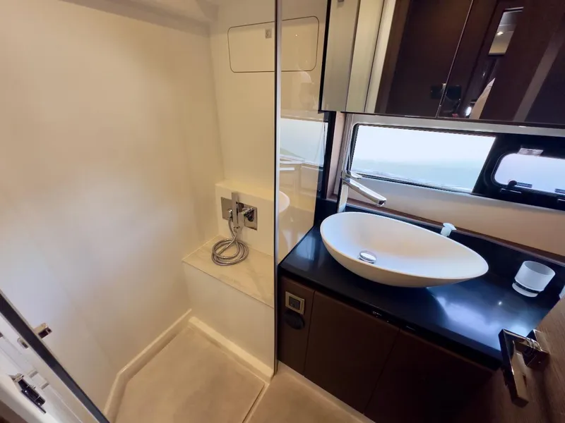 Slide: The Image of Luxurious bathroom in 2020 Prestige 460S yacht with modern sink and shower. - 31