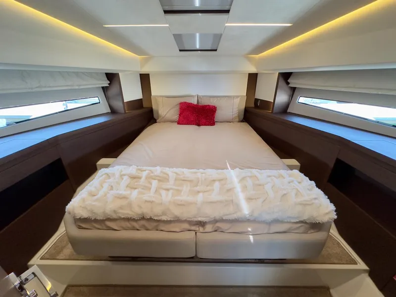 Slide: The Image of Luxurious bedroom interior of 2020 Prestige 460S yacht with modern design and cozy bedding. - 32