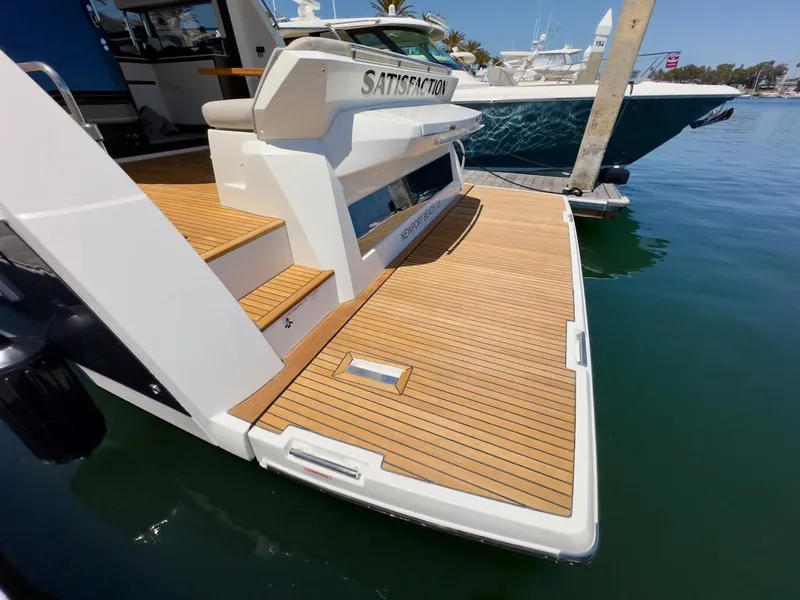 Slide: The Image of 2020 Prestige 460S yacht with teak deck, docked in a marina. - 35