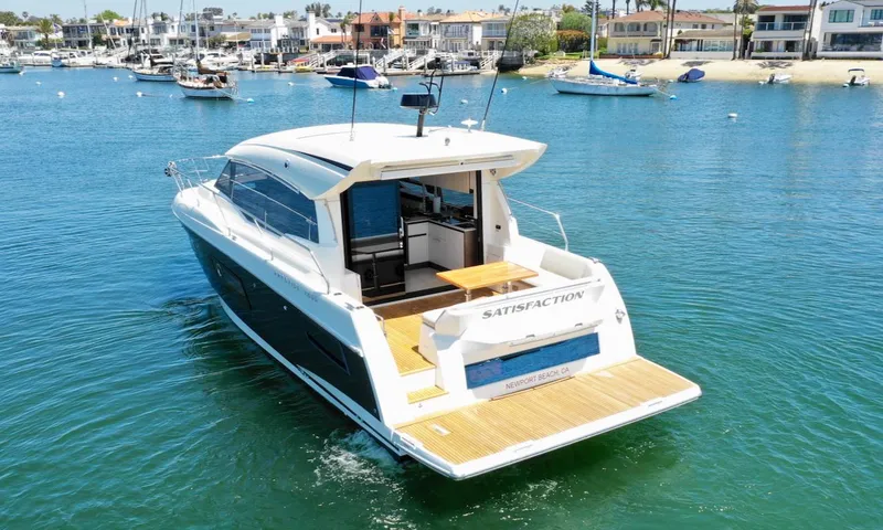 Slide: The Image of 2020 Prestige 460S yacht named "Satisfaction" cruising in Newport Beach waters. - 9