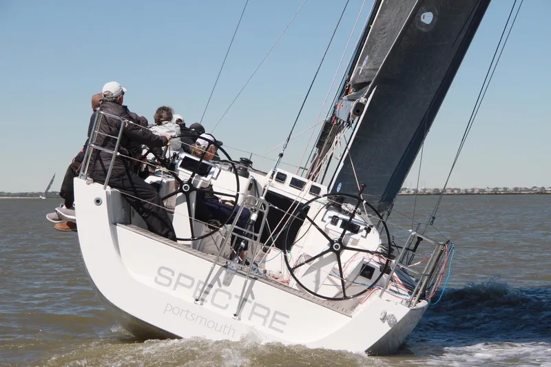Slide: The Image of 2016 X-Yachts Xp38 sailboat racing on open water with crew onboard. - 0