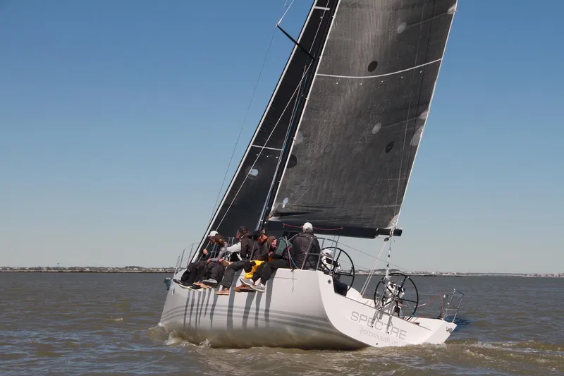 Slide: The Image of 2016 X-Yachts Xp38 sailboat racing on open water with crew onboard. - 1