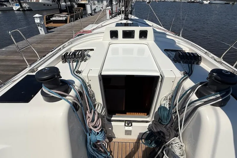 Slide: The Image of 2016 X-Yachts Xp38 sailboat cockpit with ropes and winches at marina. - 10