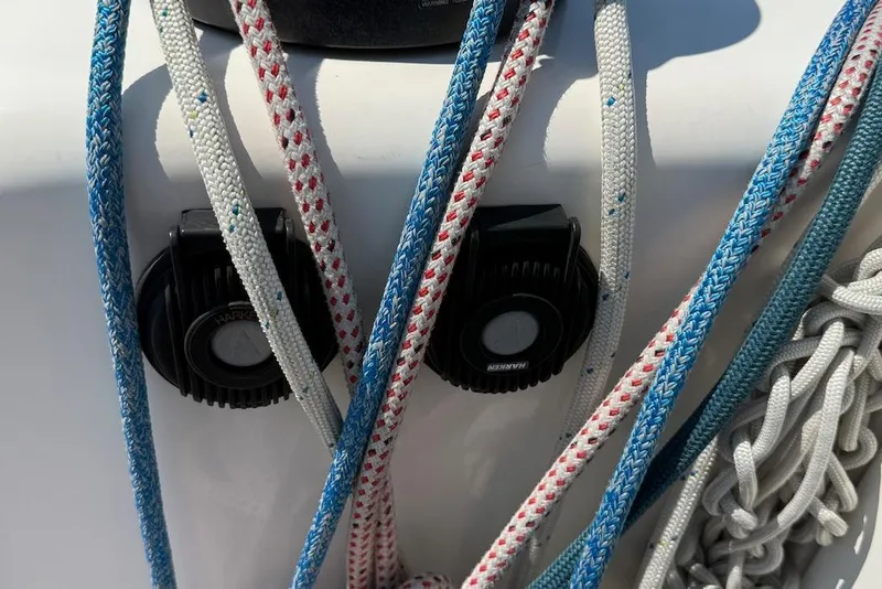 Slide: The Image of Colorful ropes and winches on a 2016 X-Yachts Xp38 sailboat deck. - 11