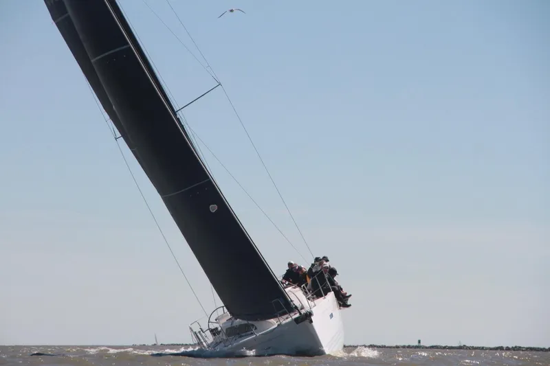 Slide: The Image of 2016 X-Yachts Xp38 sailing at an angle with crew on deck. - 2