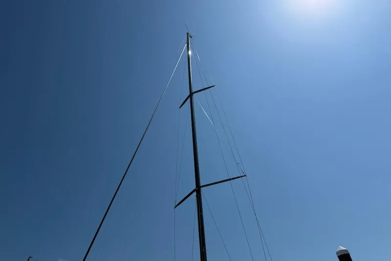 Slide: The Image of Tall mast of 2016 X-Yachts Xp38 sailboat against clear blue sky. - 24