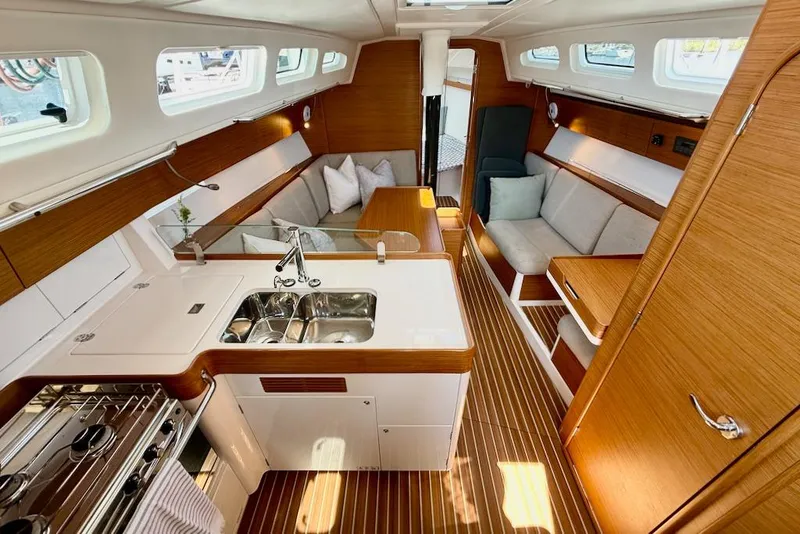Slide: The Image of Luxurious interior of 2016 X-Yachts Xp38 sailboat with modern kitchen and seating area. - 25