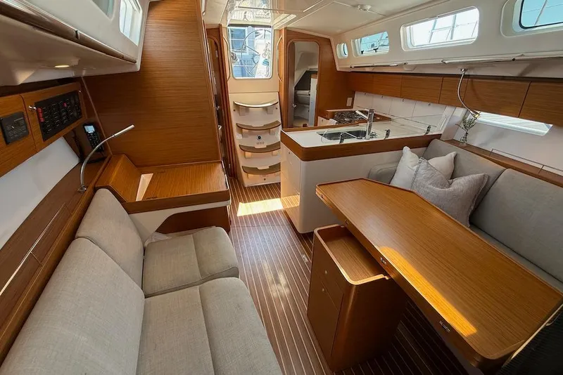 Slide: The Image of Interior of 2016 X-Yachts Xp38 sailboat with modern wood finish and cozy seating. - 27