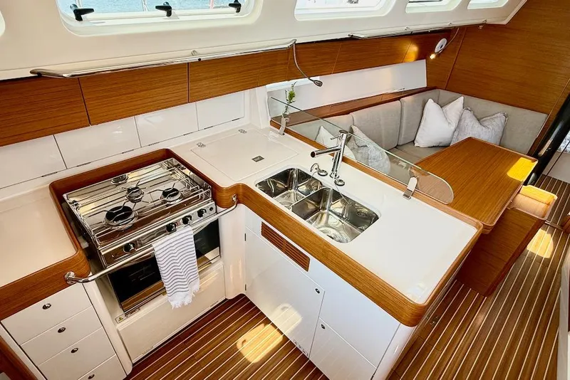 Slide: The Image of Luxurious 2016 X-Yachts Xp38 yacht interior with modern kitchen and cozy seating area. - 28
