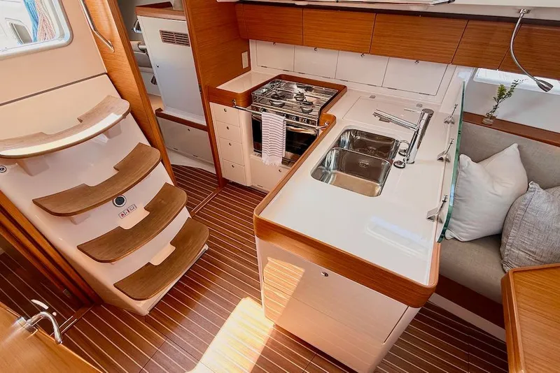 Slide: The Image of Interior of 2016 X-Yachts Xp38, featuring modern kitchen and wooden flooring. - 29