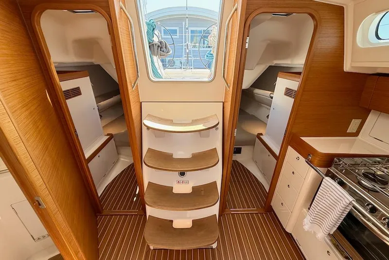 Slide: The Image of Interior of 2016 X-Yachts Xp38 sailboat with wooden finish and compact kitchen. - 30
