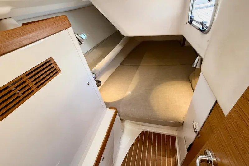 Slide: The Image of Cozy cabin interior of 2016 X-Yachts Xp38 with wooden accents and comfortable bedding. - 40