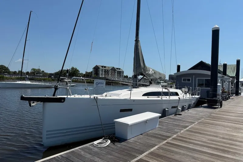 Slide: The Image of 2016 X-Yachts Xp38 sailboat docked at a marina under clear blue skies. - 5