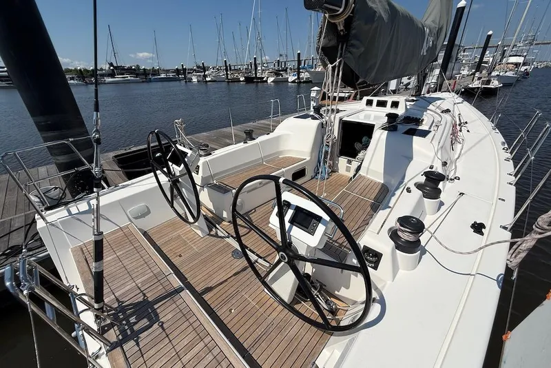 Slide: The Image of 2016 X-Yachts Xp38 sailboat with dual steering wheels docked at marina. - 6