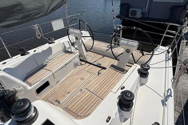Slide: The Image of 2016 X-Yachts Xp38 sailboat cockpit with dual steering wheels and teak decking. - 7