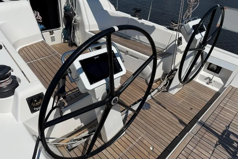 Slide: The Image of 2016 X-Yachts Xp38 yacht cockpit with dual steering wheels and navigation equipment. - 9