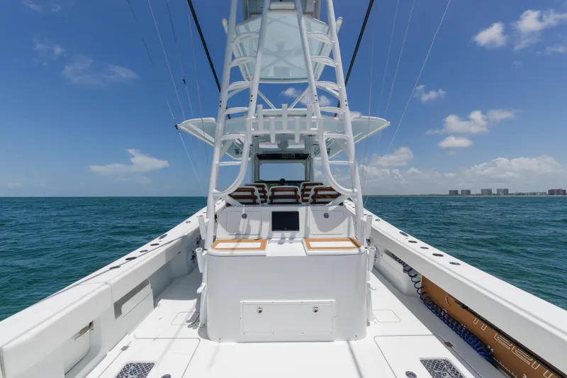 Slide: The Image of Freeman 43 boat, 2022 model, cruising on open sea under clear blue sky. - 14