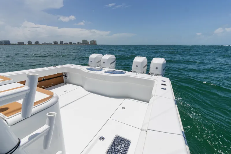 Slide: The Image of 2022 Freeman 43 boat on ocean with city skyline in background. - 16