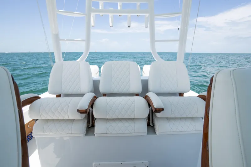 Slide: The Image of Luxury seating on a 2022 Freeman 43 boat, overlooking the ocean. - 17