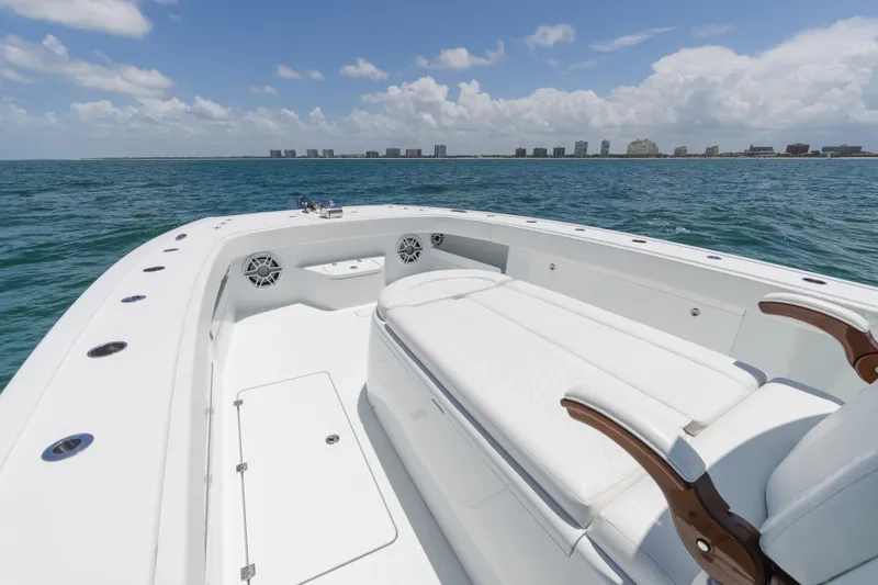 Slide: The Image of 2022 Freeman 43 boat on open water, featuring spacious seating and modern design. - 21